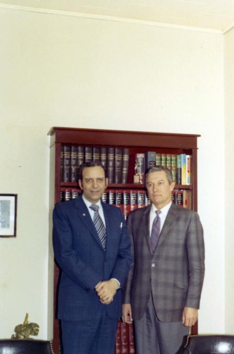 Frank Denholm with a constituent in an office