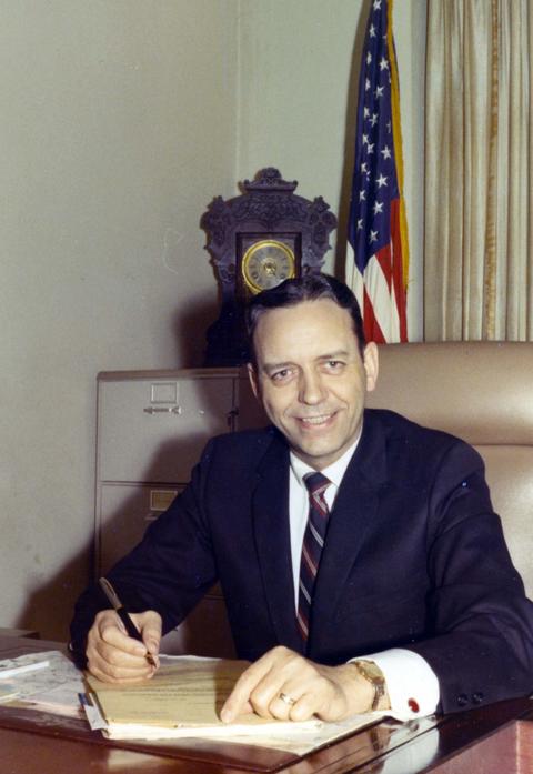 Frank Denholm working at his desk in 1968