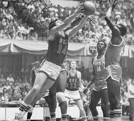 Action photo of basketball game between USA team from South Dakota delegation and Cuban national team in Cuba