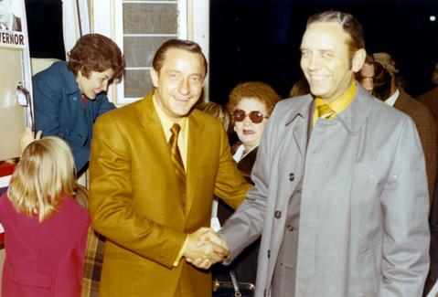 Richard Kneip congratulating Frank Denholm on his win for the U.S. House of Representatives seat