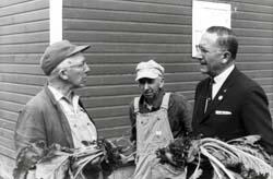 Photos: Ben Reifel talking with farmers about sugar beets